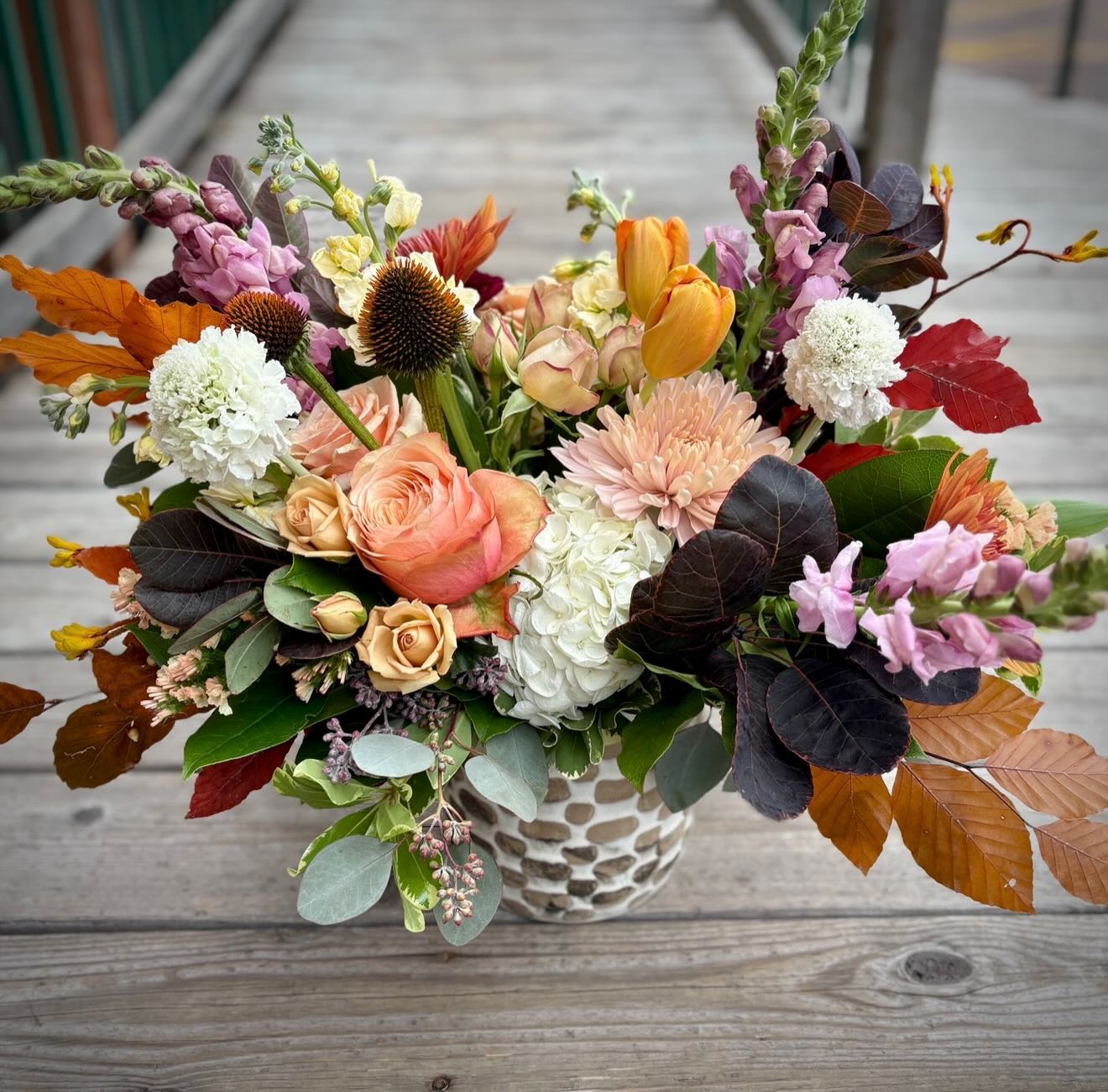 Bring warmth and fall beauty to your holiday table with our handcrafted Thanksgiving centerpiece. Filled with rich autumn blooms and seasonal accents, they’re perfect for hosting or gifting. 

Pre-order now for the holiday!
Delivery & Pickup available

Thanksgiving Hours: Nov. 24-25 (9am-4pm) Nov. 26 (9am-12pm) Nov. 27 CLOSED